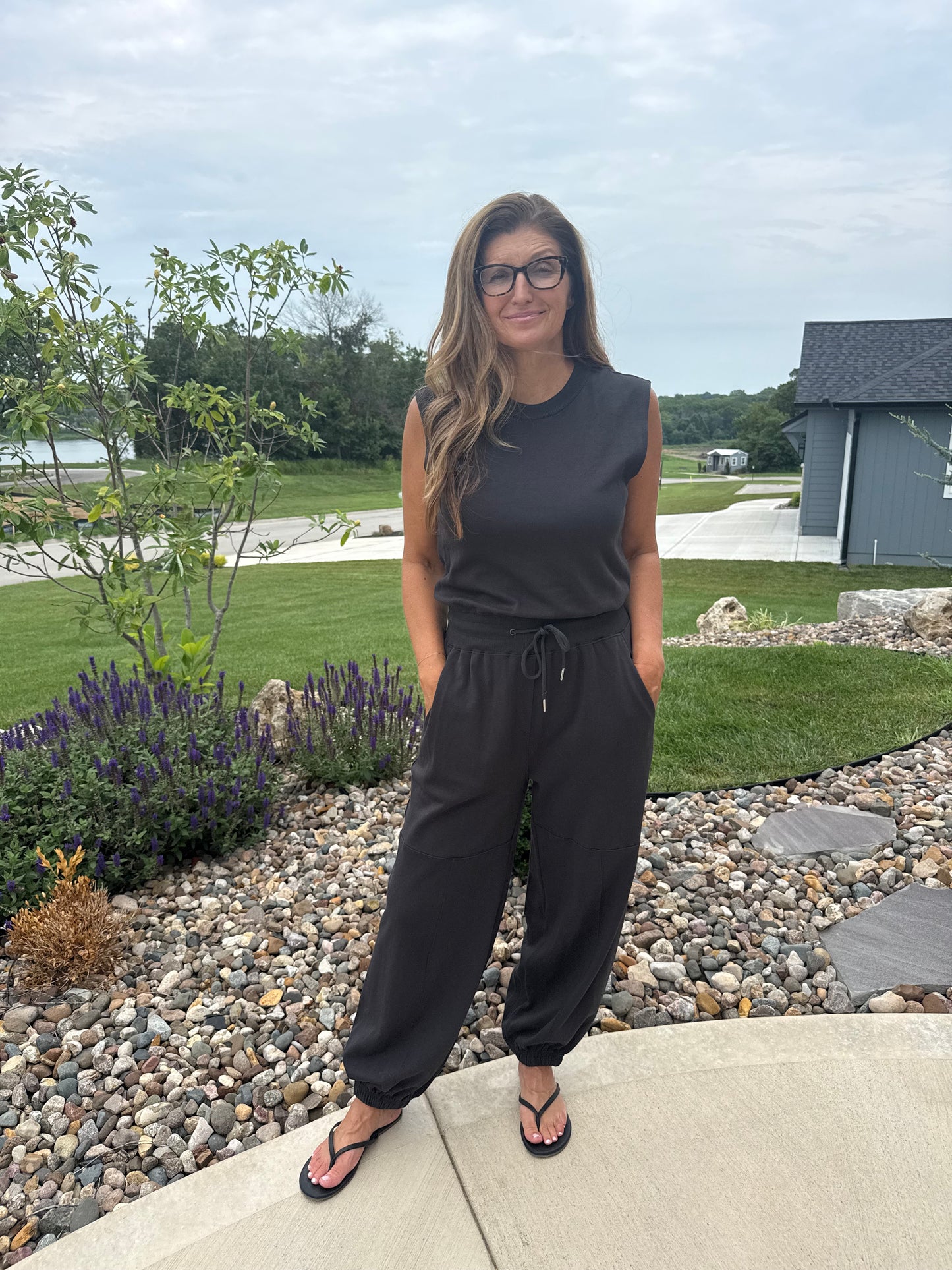 SLEEVELESS KNIT ACTIVE JUMPSUIT: BLACK