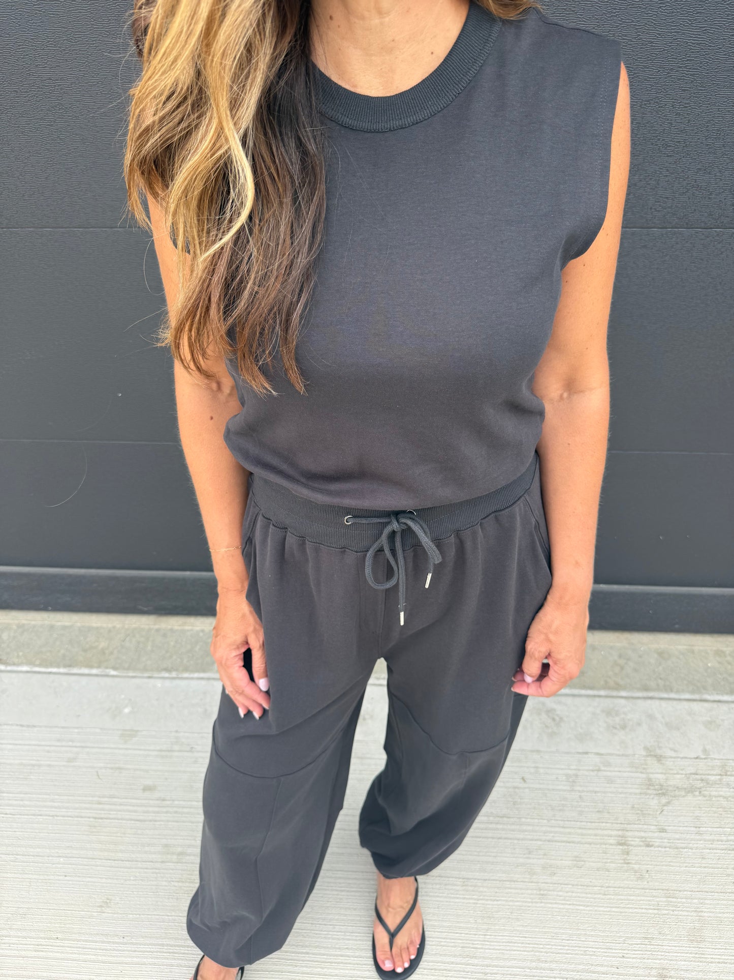 SLEEVELESS KNIT ACTIVE JUMPSUIT: BLACK