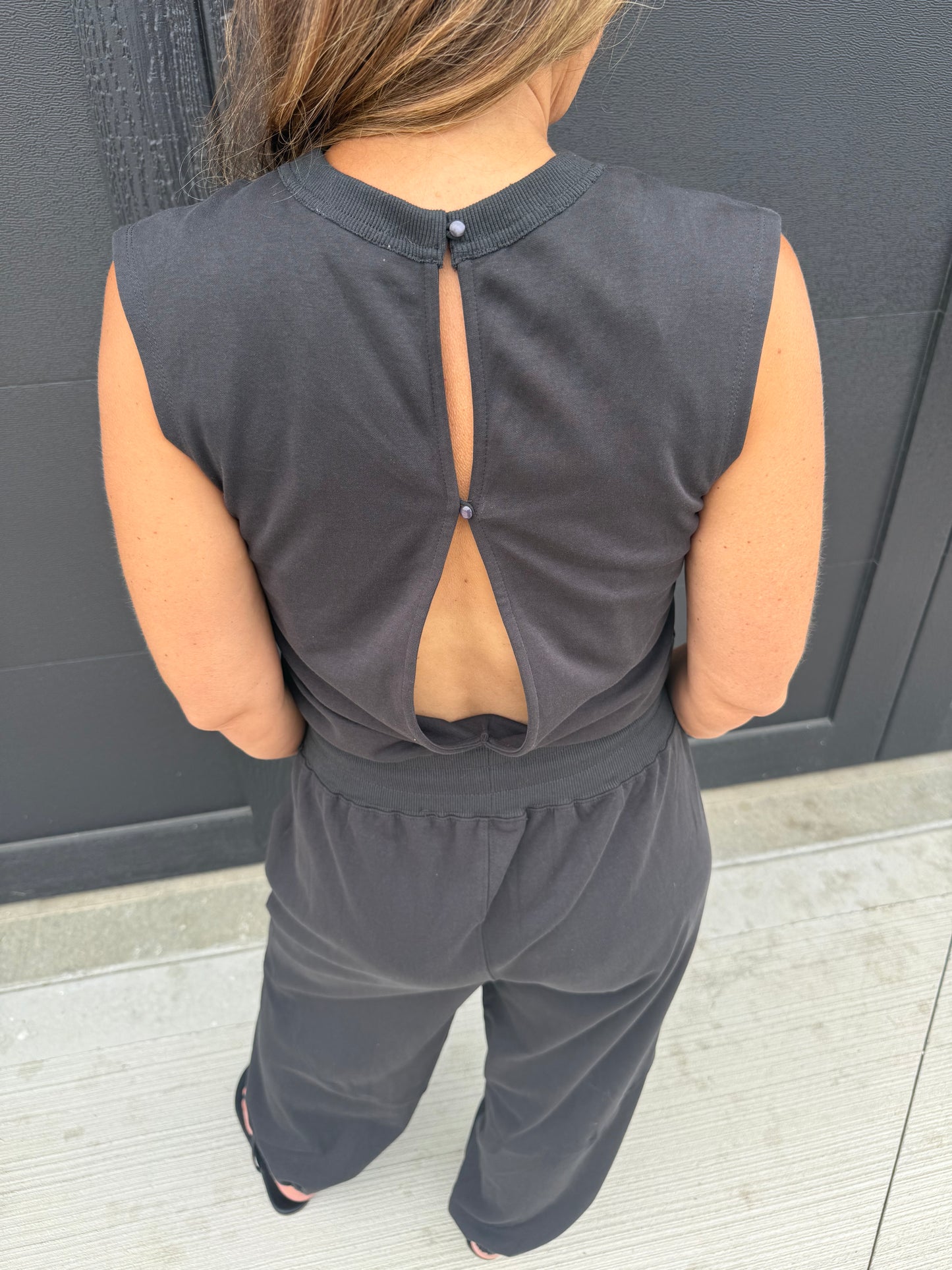 SLEEVELESS KNIT ACTIVE JUMPSUIT: BLACK